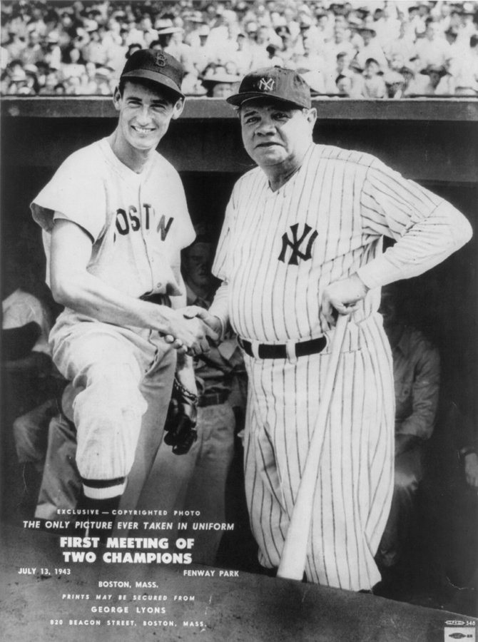 Ted Williams in a Boston uniform shaking hands with Babe Ruth in Yankee pinstripes in the Fenway Park dugout, from a 1943 press print.